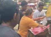 Simpatisan GM-WIN Bagi- Bagi Ikan, Kepada Masyarakat Kota Bitung.