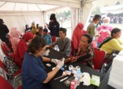 Relawan PLN Berikan Bantuan Pendidikan dan Kesehatan Warga Kampung Pemulung Jurang Mangu Timur
